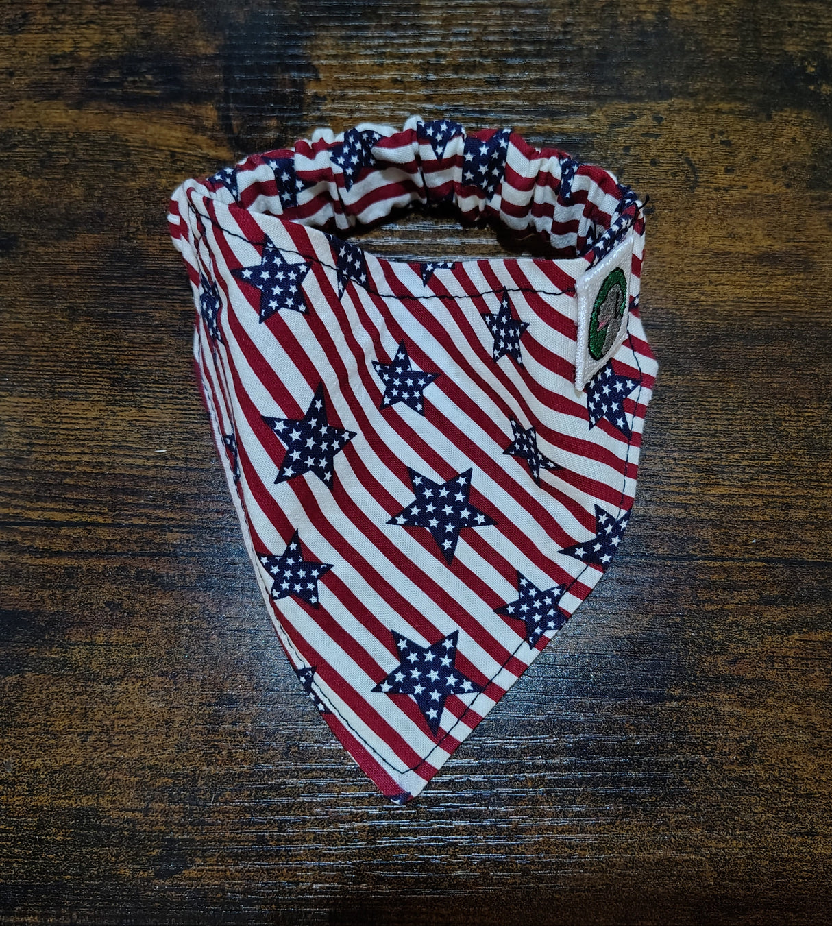 American flag patterned bandana on a wooden surface