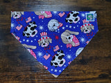 Dog bandana with patriotic dog pattern on a wooden surface
