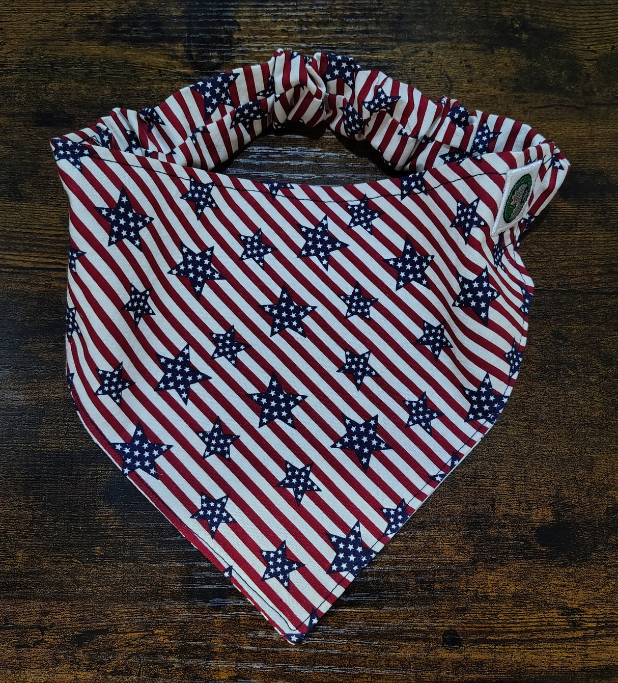 American flag patterned bandana on a wooden surface