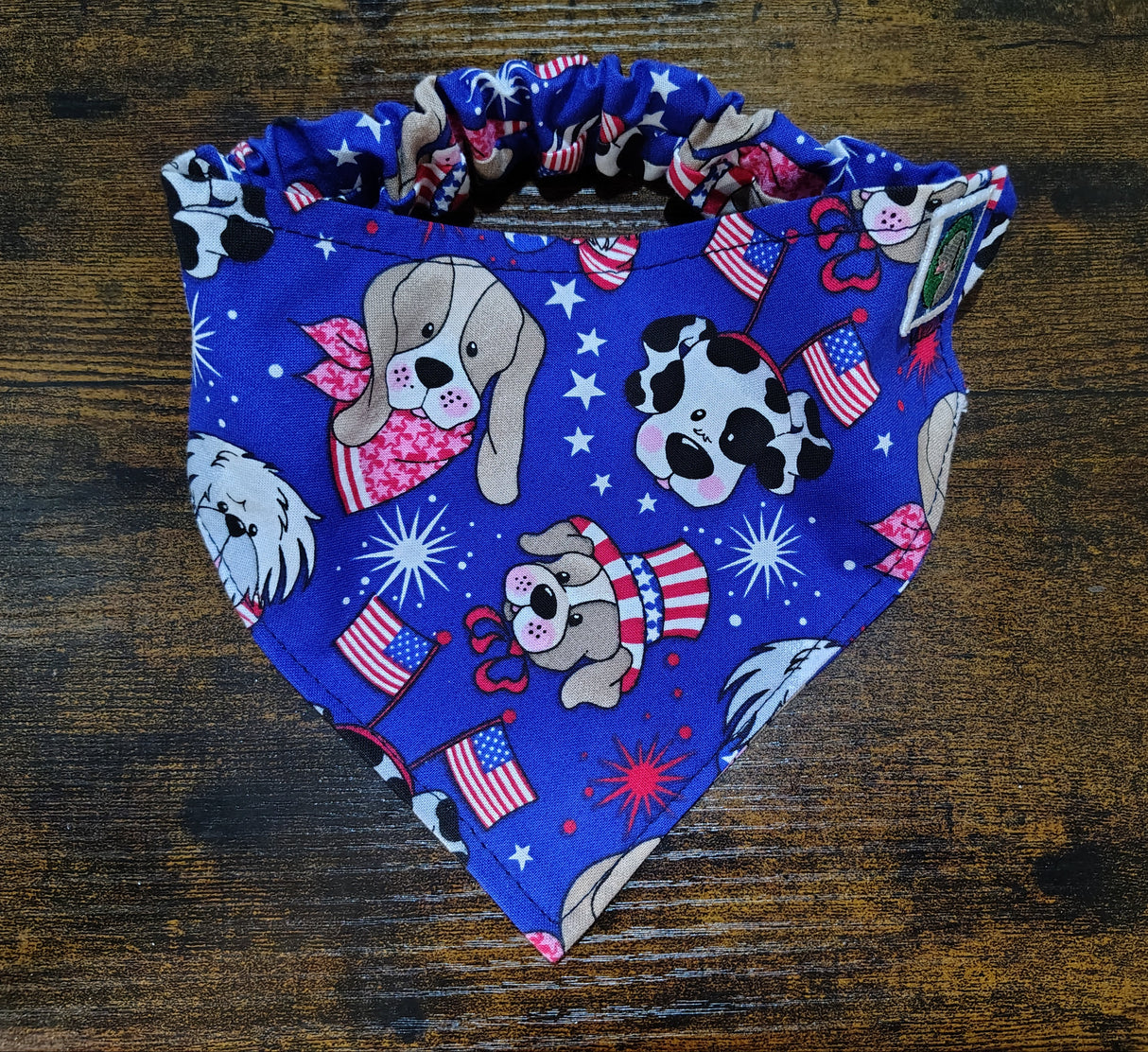 Fabric with dog-themed design on a wooden surface