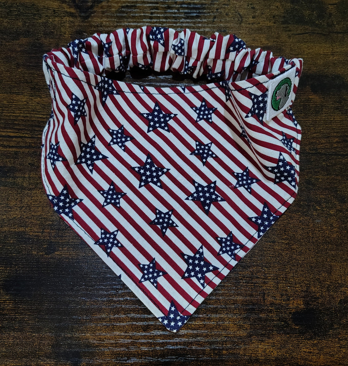 Folded fabric with American flag pattern on a wooden surface