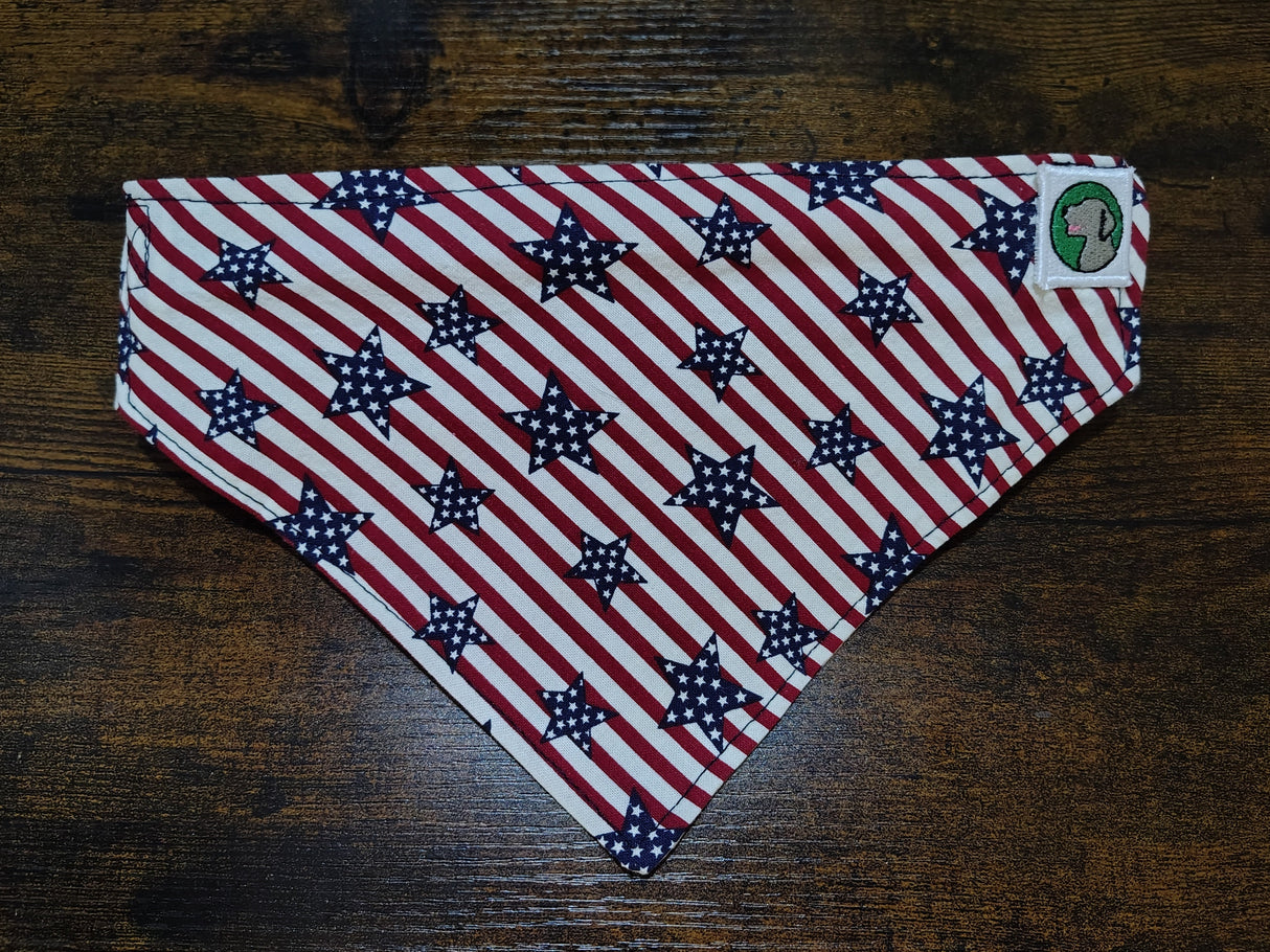 American flag patterned triangle-shaped item on a wooden surface