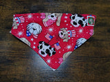 Red bandana with cartoon dog designs on a wooden surface